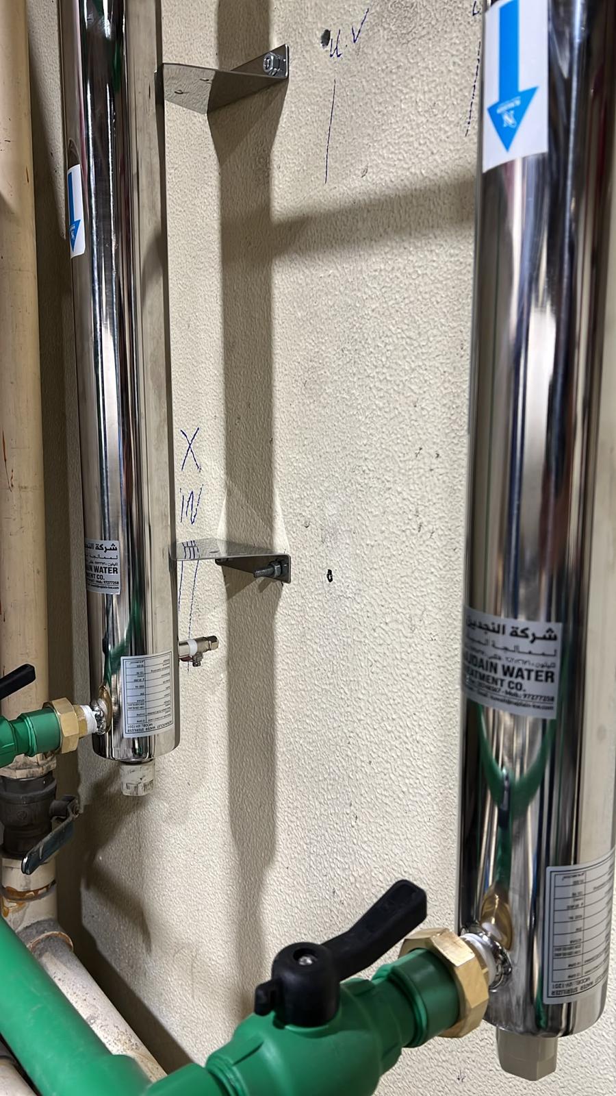 Pair of Alnajdain UV sterilizers mounted on wall